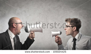stock-photo-adult-businessman-screaming-into-a-megaphone-against-a-younger-businessman-talking-into-a-smaller-105024425